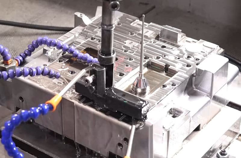 Multi-axis CNC milling of large injection mold component with coolant system and fixture setup