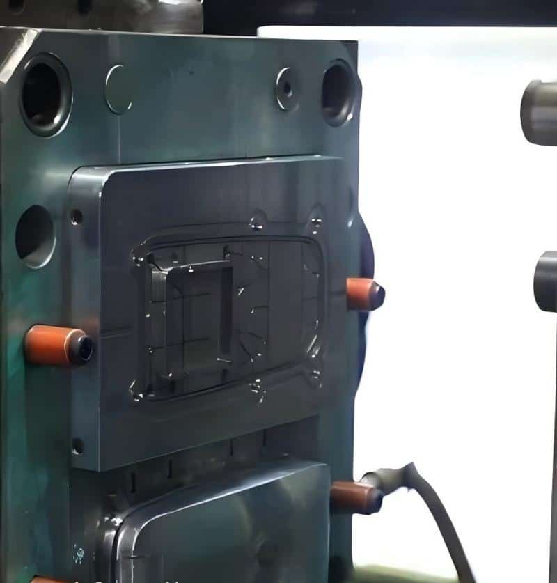 Injection mold installed on a molding machine, ready for production run