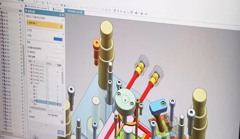 3D mold modeling interface showing ejector pins, cooling channels, slide mechanisms, and parametric design tree