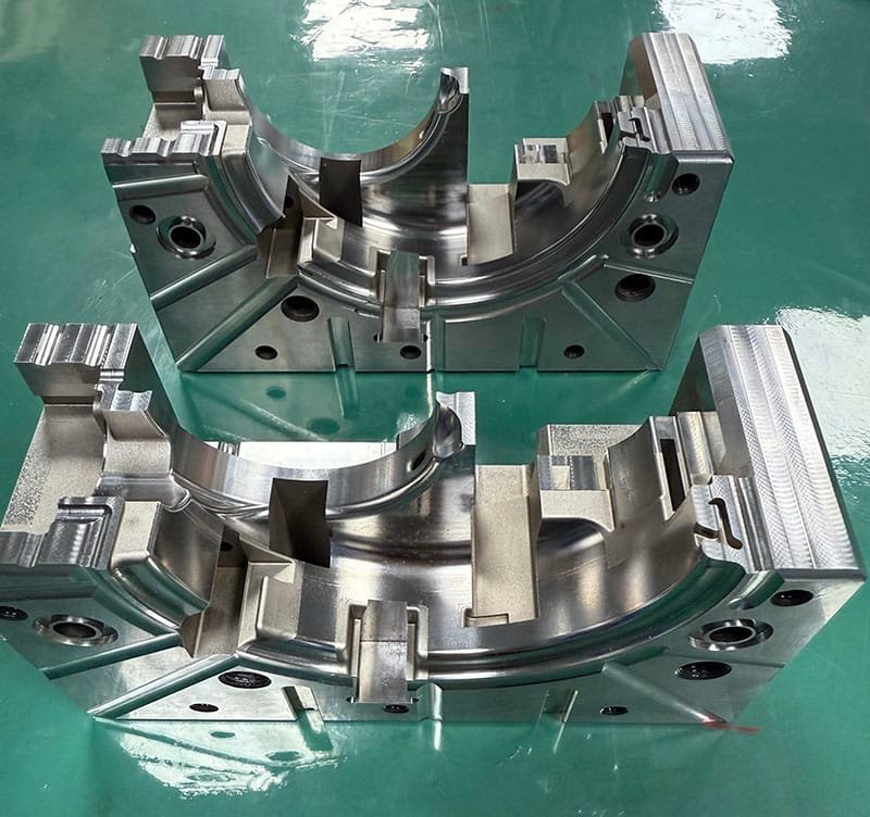 Complete injection mold cavity and core assembly showing symmetrical design and tight fit