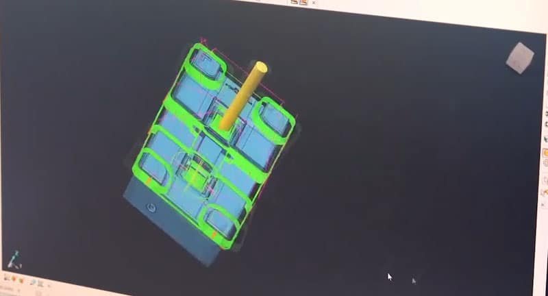 3D CAD model of multi-cavity injection mold showing gate location and cavity layout for balanced resin flow