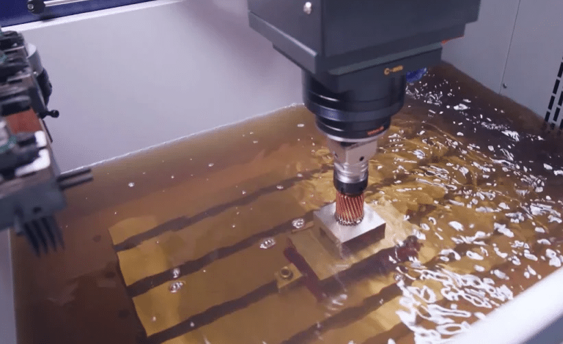 Sinker EDM machining process for precision mold components using copper electrode in dielectric fluid