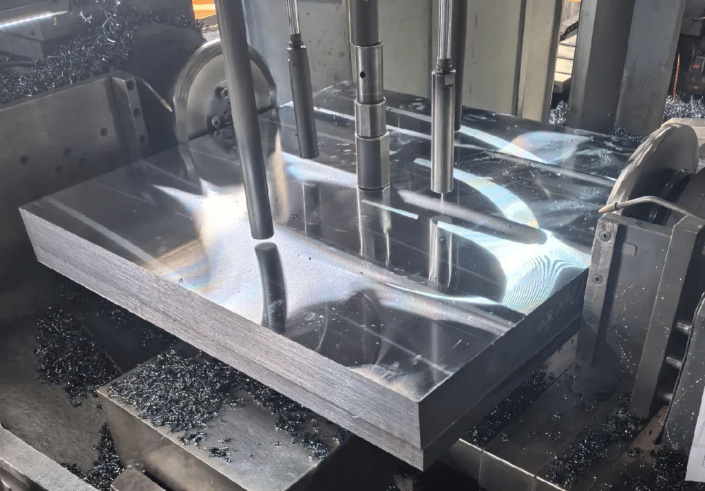 CNC machining of heat-treated mold steel block showing surface finish and dimensional accuracy