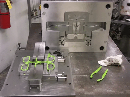 Injection mold trial showing molded plastic parts and runner system after sampling at a professional mold making manufacturer