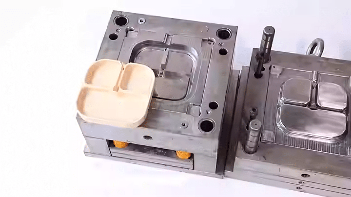 Injection mold trial sample showing molded plastic part and cavity surface quality for OEM validation