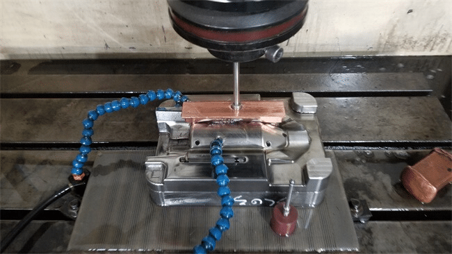 CNC machining of injection mold core with precision milling and cooling setup influencing mold cost, durability, and tool life.