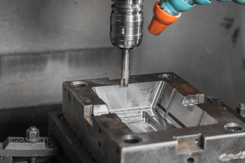 CNC milling process machining a precision mold cavity with tight tolerances