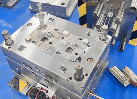 Precision injection mold with integrated cooling channels and alignment pins for tight tolerance molding