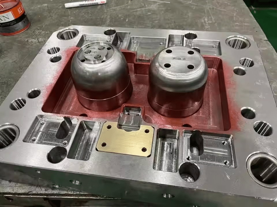 Precision injection mold core and cavity components showing machining accuracy, vent holes, and fit quality that affect mold performance and failure risk