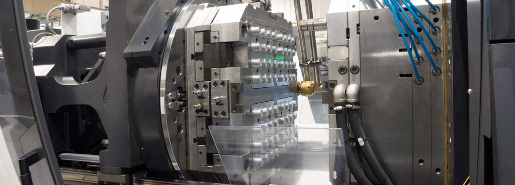 Multi-cavity precision injection mold mounted on injection molding machine for stable high-volume production