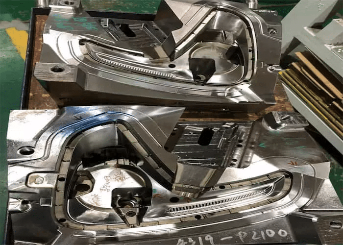 Complex injection mold assembly showing tight tolerance control of core, cavity, and sliding components for dimensional accuracy