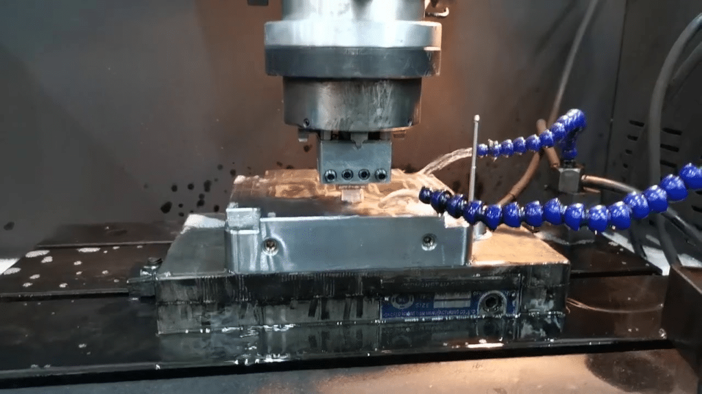 CNC machining of precision mold component, ensuring flatness and surface accuracy for proper mold assembly and fitting